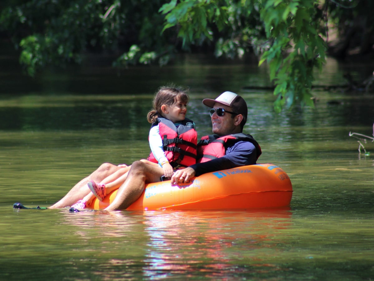 father and daughter tubing on the shenandoah river