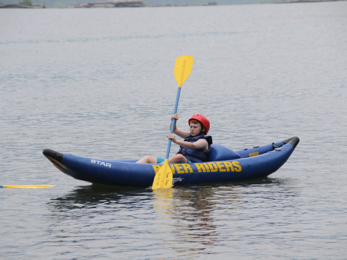 boy on inflatable kayak on the Potomac river