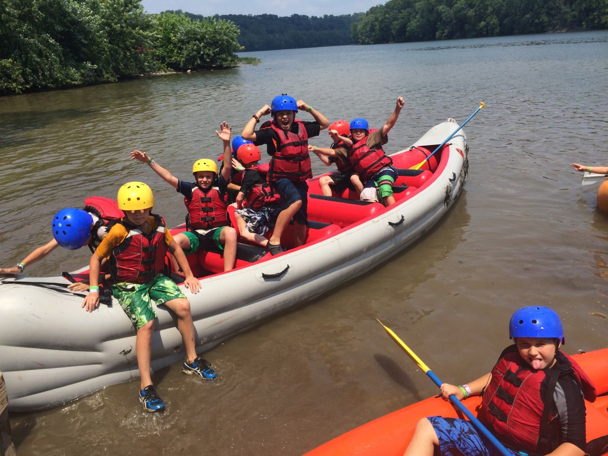 group of kids in inflatable kayaks