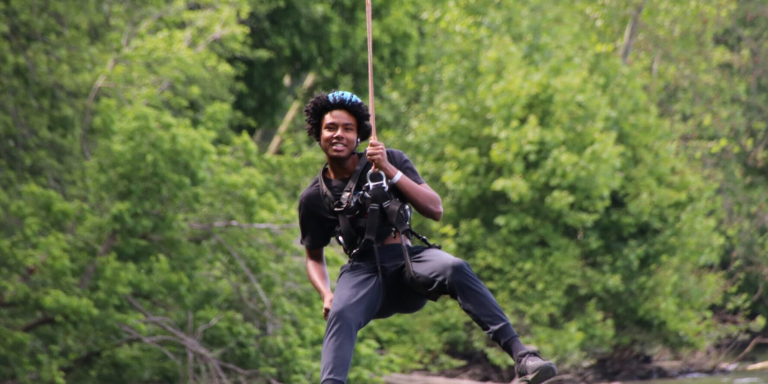 young man ziplining